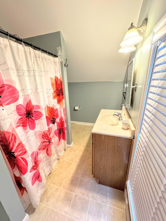 bathroom featuring a shower with shower curtain, vanity, and tile patterned floors