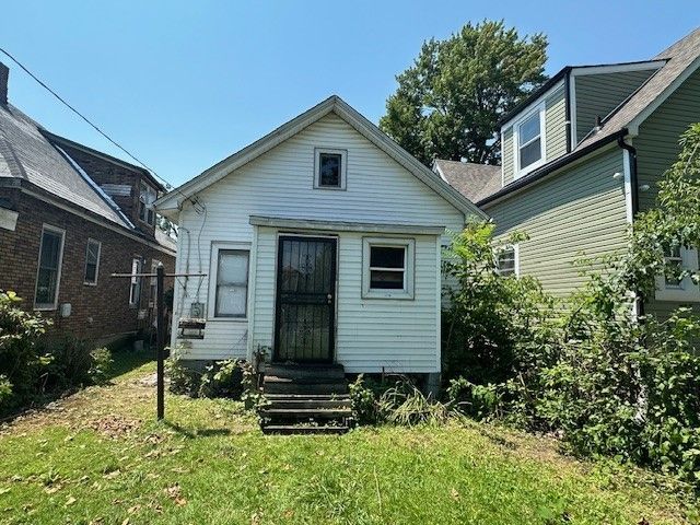 4238 Bangor St, Detroit, MI 48210 - rear view of property featuring a lawn