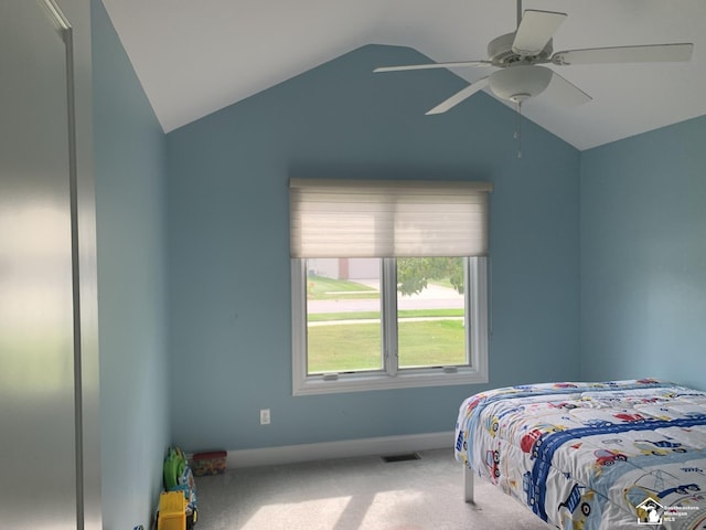 bedroom featuring carpet flooring, vaulted ceiling, and ceiling fan