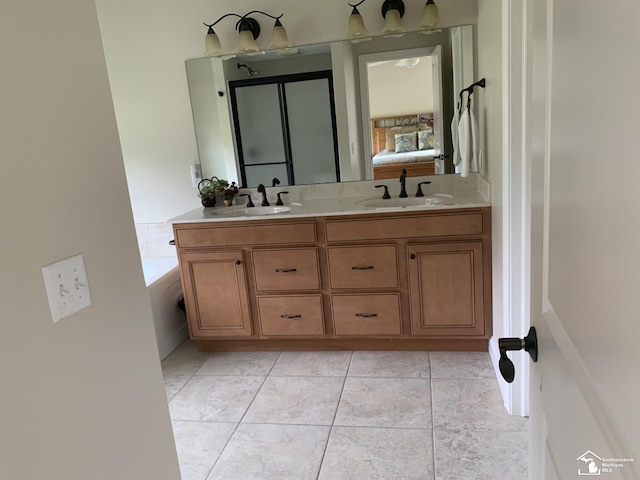 bathroom featuring tile patterned flooring and vanity