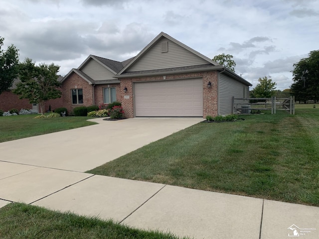 ranch-style home with a front lawn and a garage