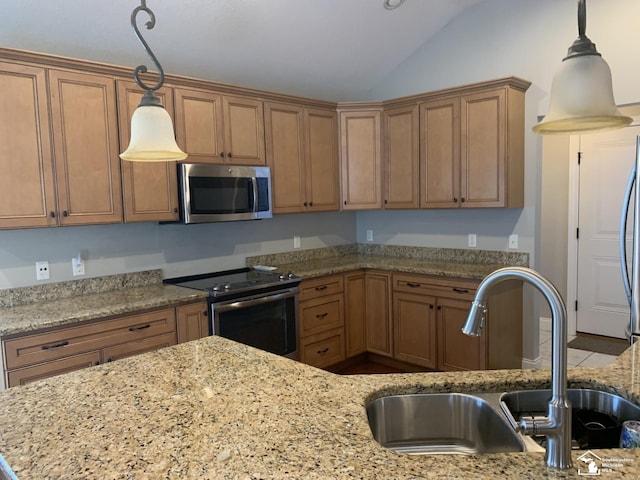 kitchen featuring sink, stainless steel appliances, light stone counters, decorative light fixtures, and vaulted ceiling