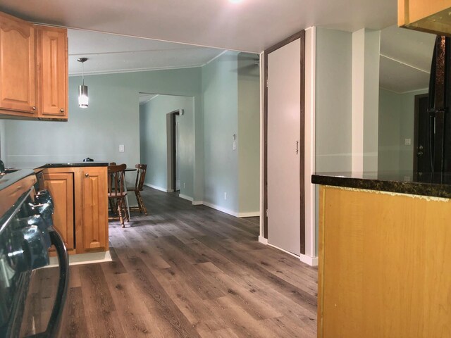 6566 E Stolberg Rd, Fountain, MI 49410 - kitchen featuring dark wood finished floors, stove, ornamental molding, baseboards, and hanging light fixtures