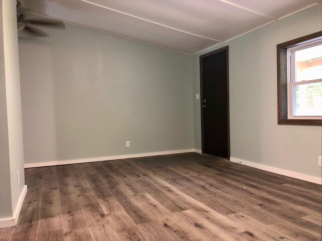 6566 E Stolberg Rd, Fountain, MI 49410 - empty room with wood finished floors, ceiling fan, and baseboards