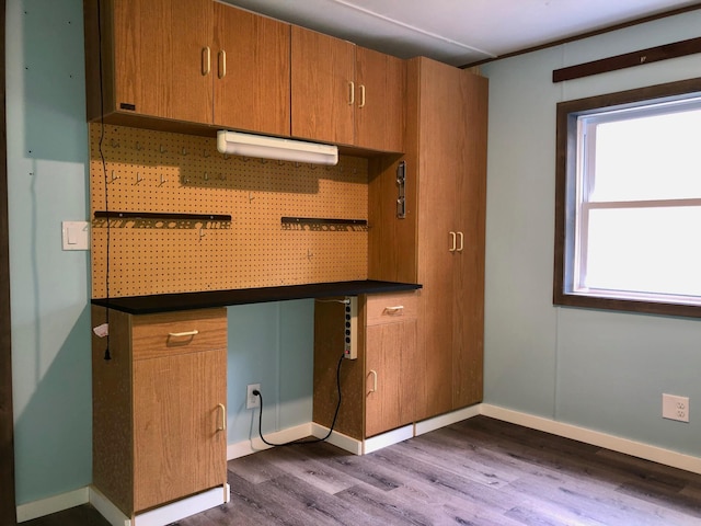 kitchen with backsplash and hardwood / wood-style floors