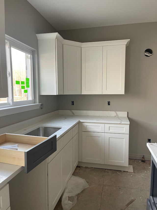 kitchen featuring white cabinets