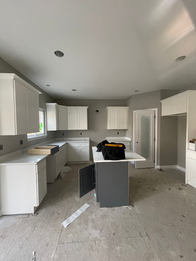 kitchen featuring white cabinets and a center island