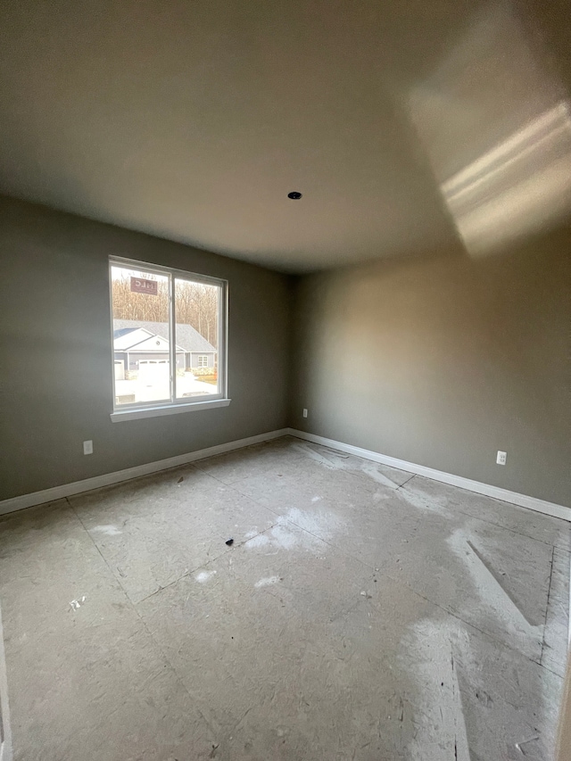 empty room with baseboards