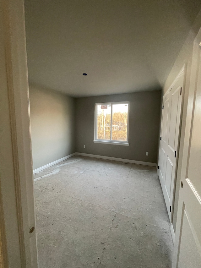 unfurnished bedroom featuring baseboards