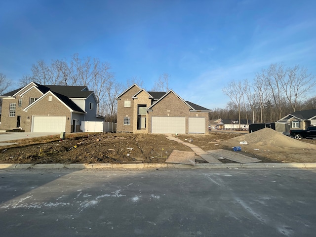 view of front of property featuring brick siding, a residential view, and driveway