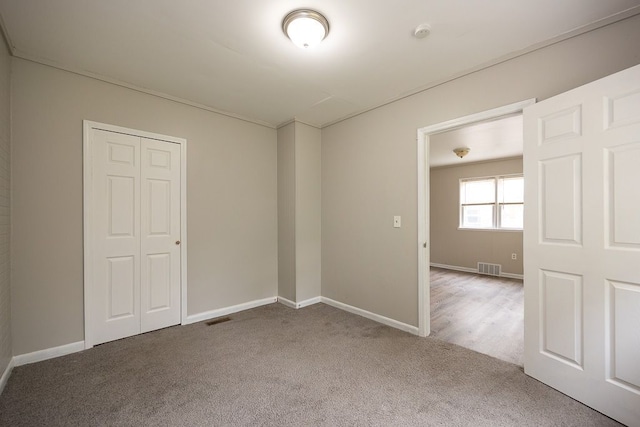 empty room with carpet flooring