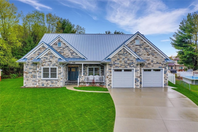 craftsman inspired home with a porch, a garage, and a front lawn