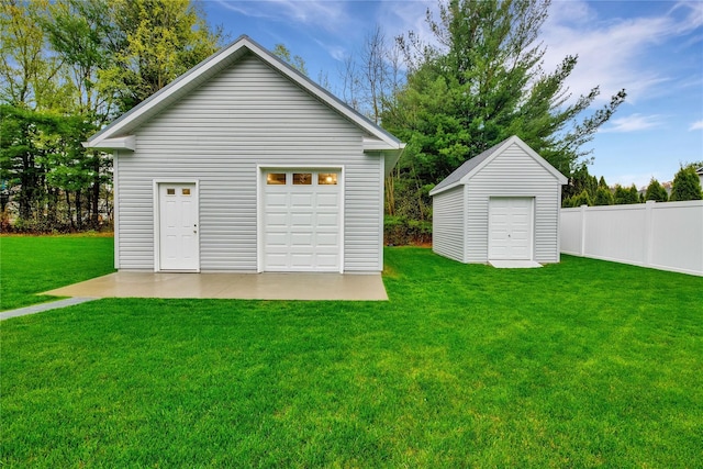 garage with a lawn