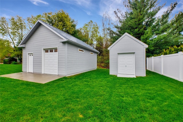 garage with a lawn