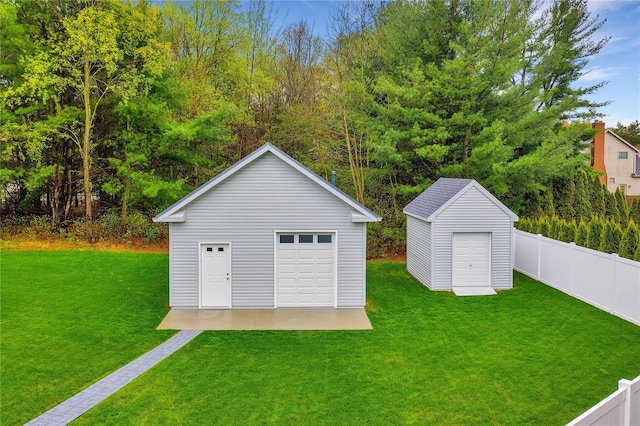 garage featuring a lawn