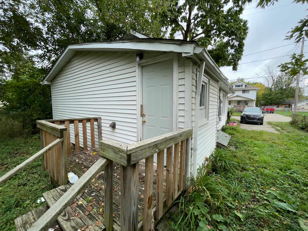 view of home's exterior with a lawn