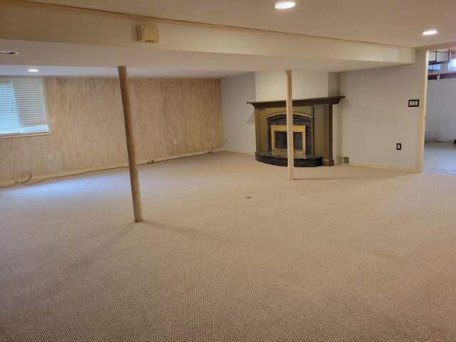 31990 Nottingwood St, Farmington Hills, MI 48334 - below grade area with carpet floors, baseboards, a high end fireplace, recessed lighting, and wooden walls