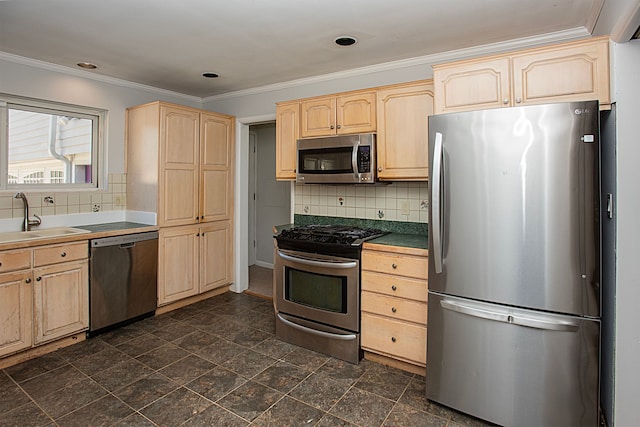 kitchen featuring appliances with stainless steel finishes, tasteful backsplash, light brown cabinetry, and sink