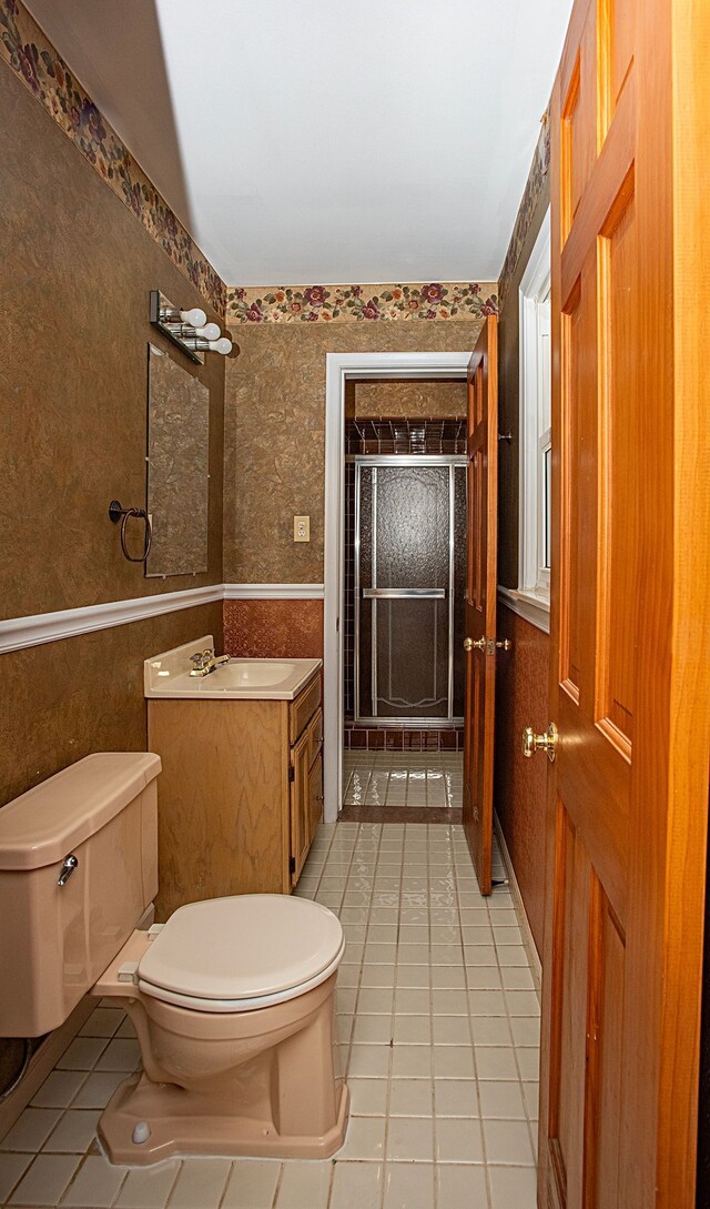 31990 Nottingwood St, Farmington Hills, MI 48334 - bathroom featuring toilet, tile patterned floors, vanity, a shower with shower door, and wallpapered walls