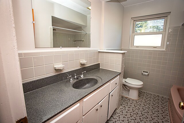 31990 Nottingwood St, Farmington Hills, MI 48334 - bathroom featuring tile walls, vanity, a shower, toilet, and tile patterned floors