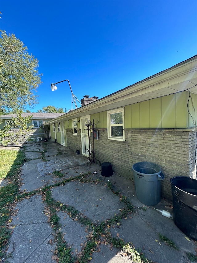 view of property exterior with a patio