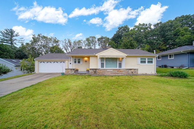 ranch-style home featuring a front lawn and a garage