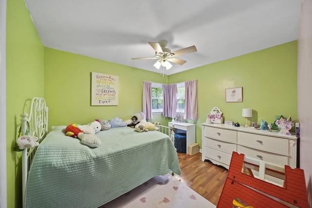 bedroom with ceiling fan and light wood-type flooring