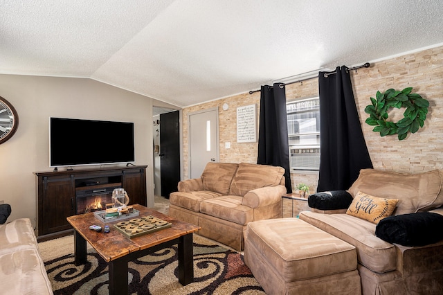 living room featuring a textured ceiling and vaulted ceiling