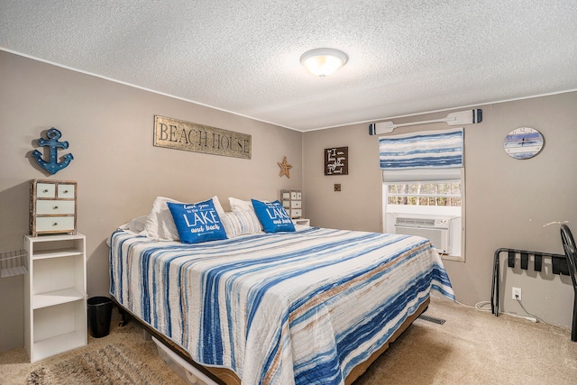 bedroom featuring carpet flooring and a textured ceiling