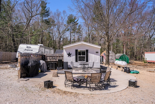 view of patio / terrace with a storage shed