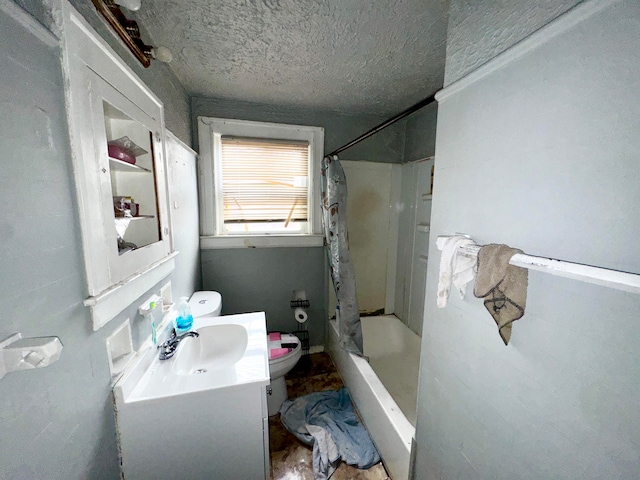 bathroom with walk in shower, vanity, a textured ceiling, and toilet