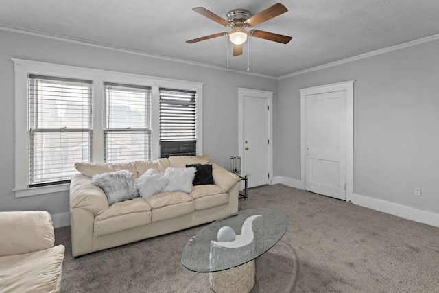 living room with carpet, a textured ceiling, ceiling fan, and crown molding