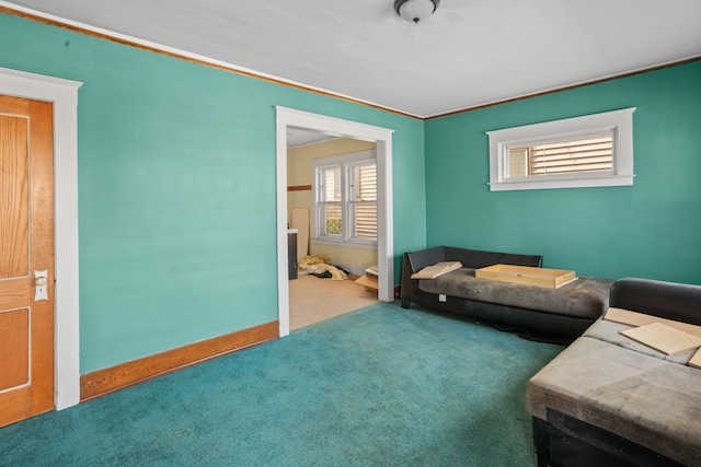 carpeted living room featuring crown molding