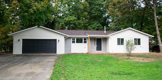 single story home featuring a front yard and a garage