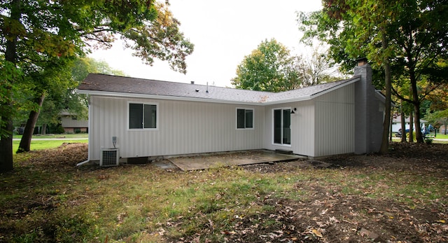 back of house with a patio area and cooling unit