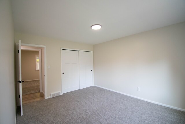 58085 Dulwich, Washington, MI 48094 - unfurnished bedroom featuring carpet floors, baseboards, and a closet
