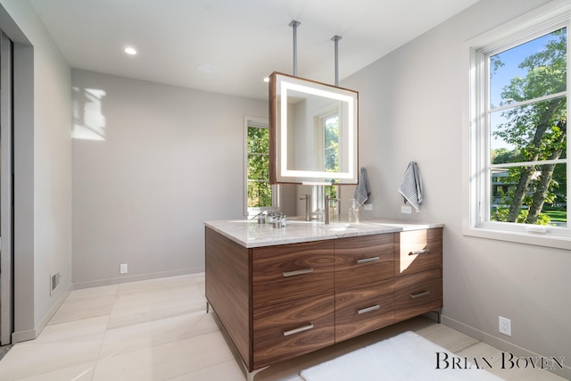 bathroom featuring tile patterned flooring and vanity