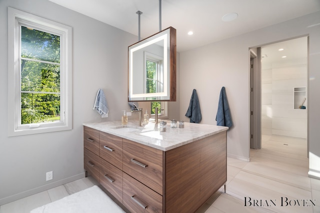 bathroom with tile patterned flooring and vanity