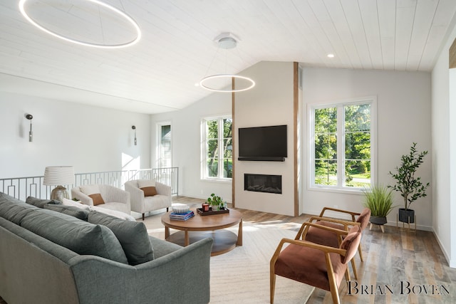 living room with wood-type flooring, vaulted ceiling, and wood ceiling