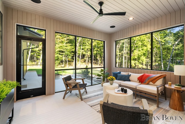 sunroom / solarium with ceiling fan and wooden ceiling