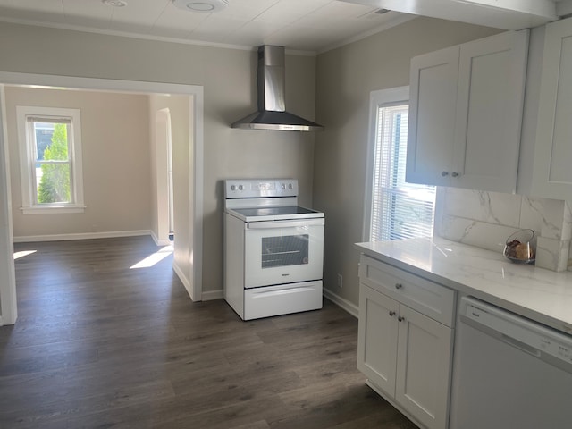 kitchen featuring white cabinetry, white appliances, dark hardwood / wood-style floors, and wall chimney range hood