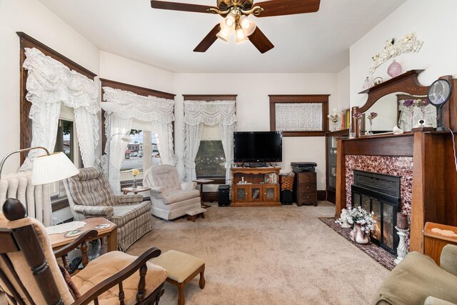 207 N Pine River St, Ithaca, MI 48847 - carpeted living area with ceiling fan and a tiled fireplace