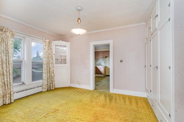 empty room featuring carpet, a textured ceiling, crown molding, and a baseboard radiator