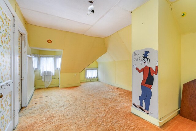 207 N Pine River St, Ithaca, MI 48847 - bonus room with carpet flooring and lofted ceiling