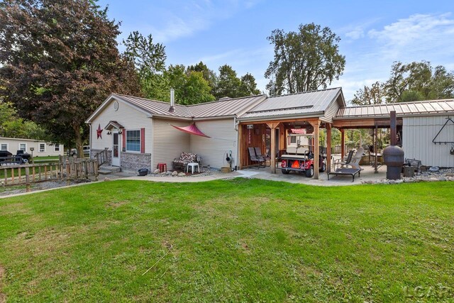 rear view of house with a lawn