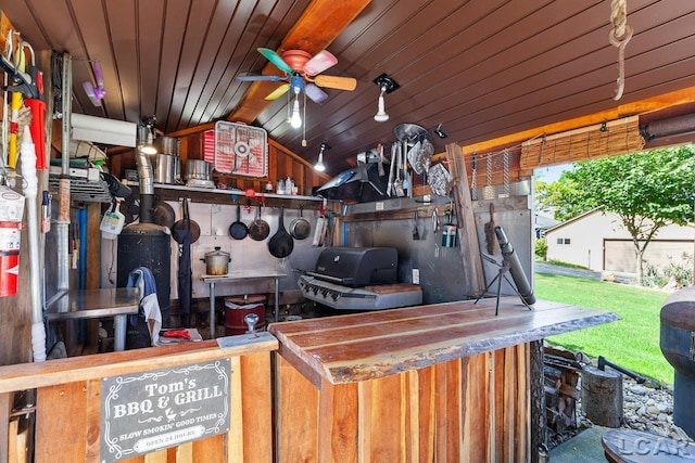 exterior space with ceiling fan