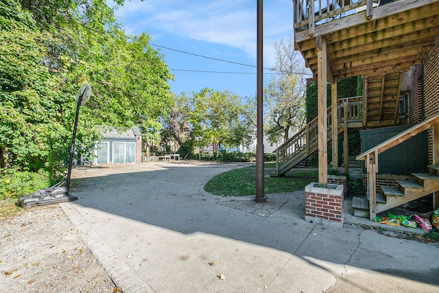 view of yard with a shed and a patio area