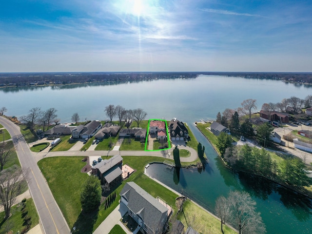 birds eye view of property featuring a residential view and a water view