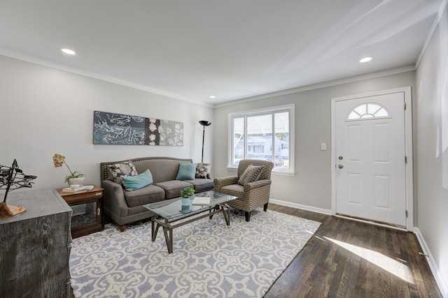 living room with dark hardwood / wood-style floors and crown molding