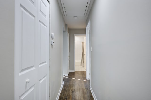 corridor with dark wood-type flooring